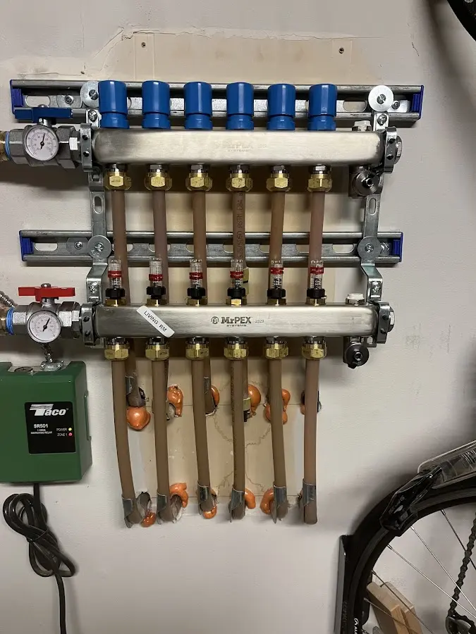 Plumber performing Water Heater Repair at a residential property in Maplewood